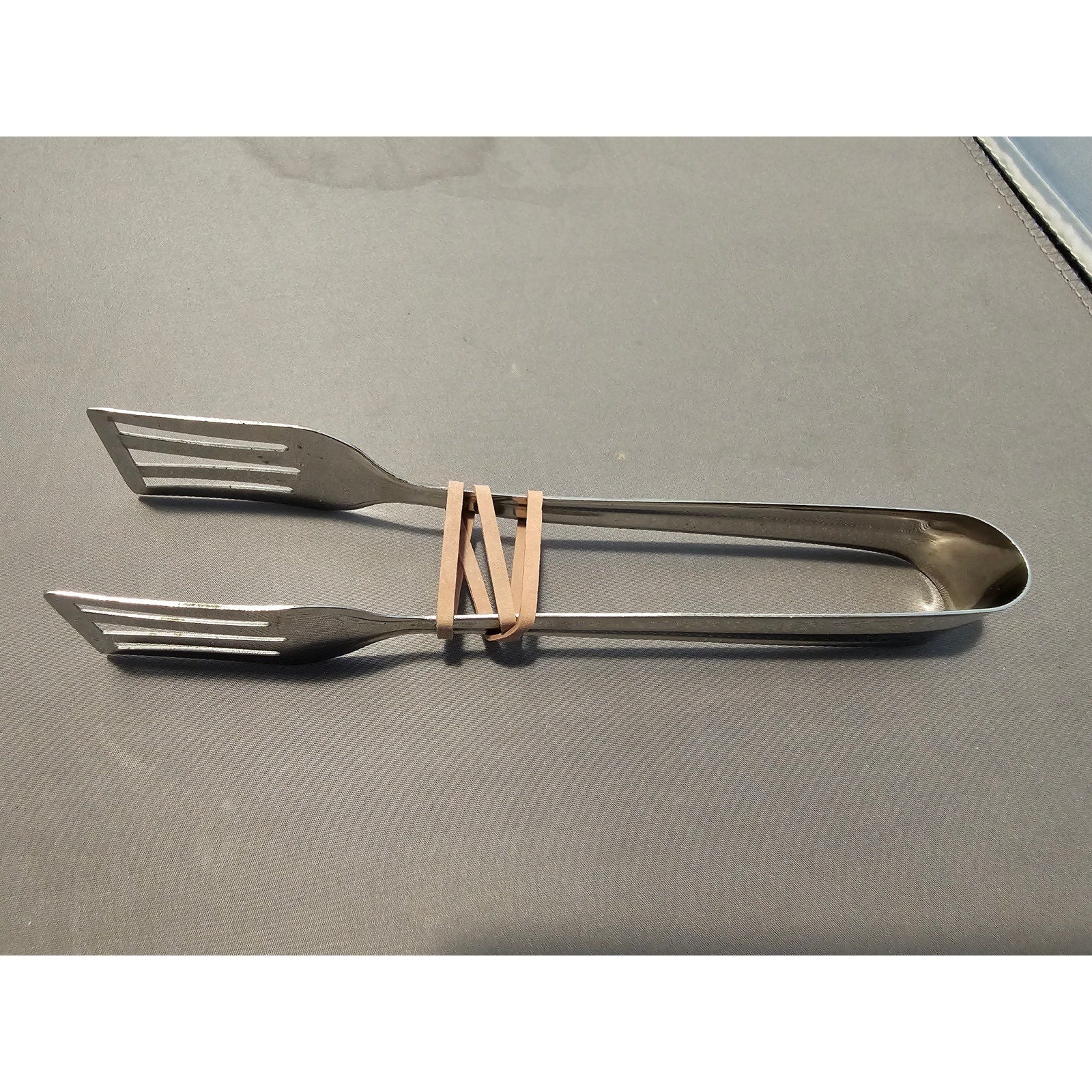 Silver Stainless Steel Tongs - 7" Long (used)