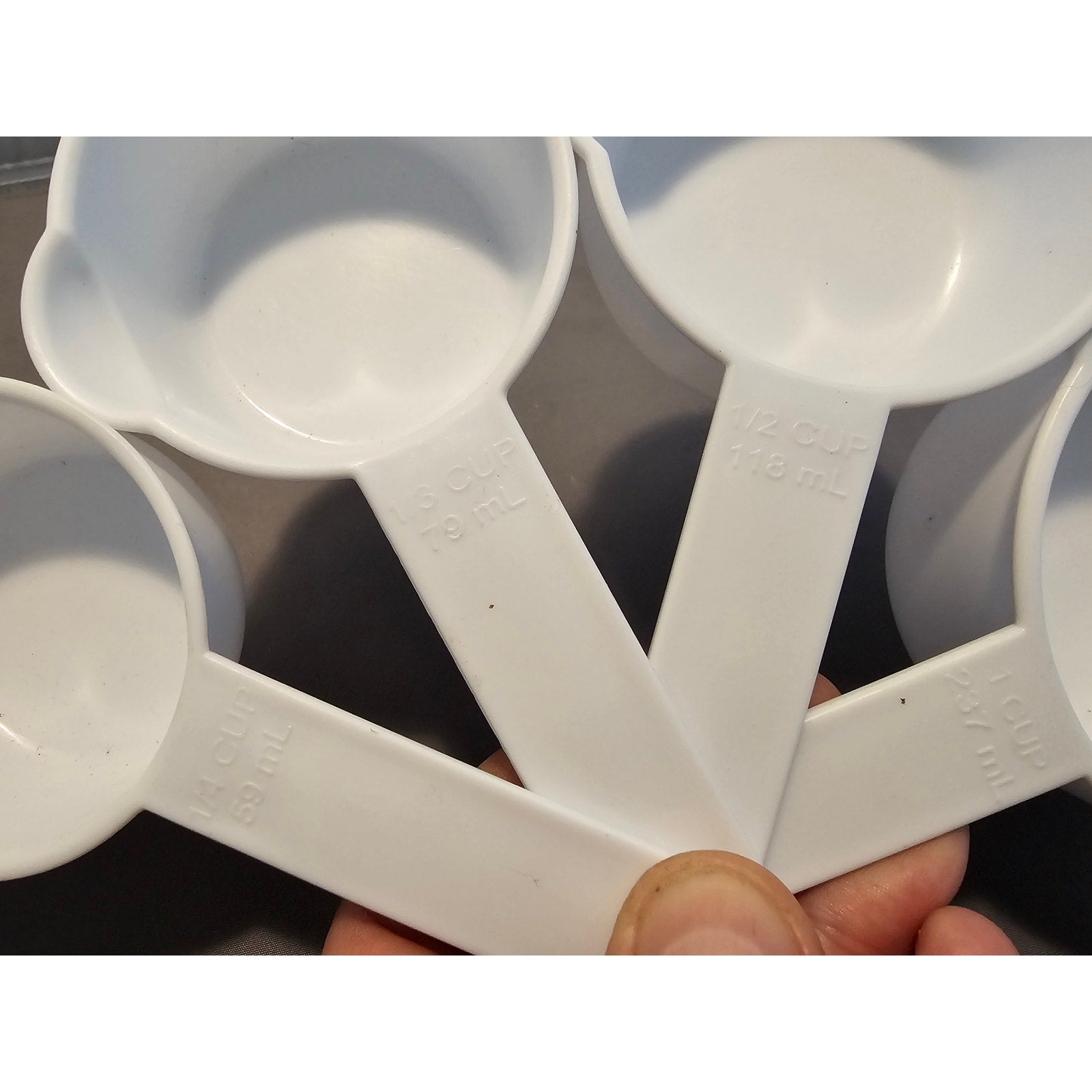 Set of 4 White Plastic Nesting Measuring Cups w/Ring
